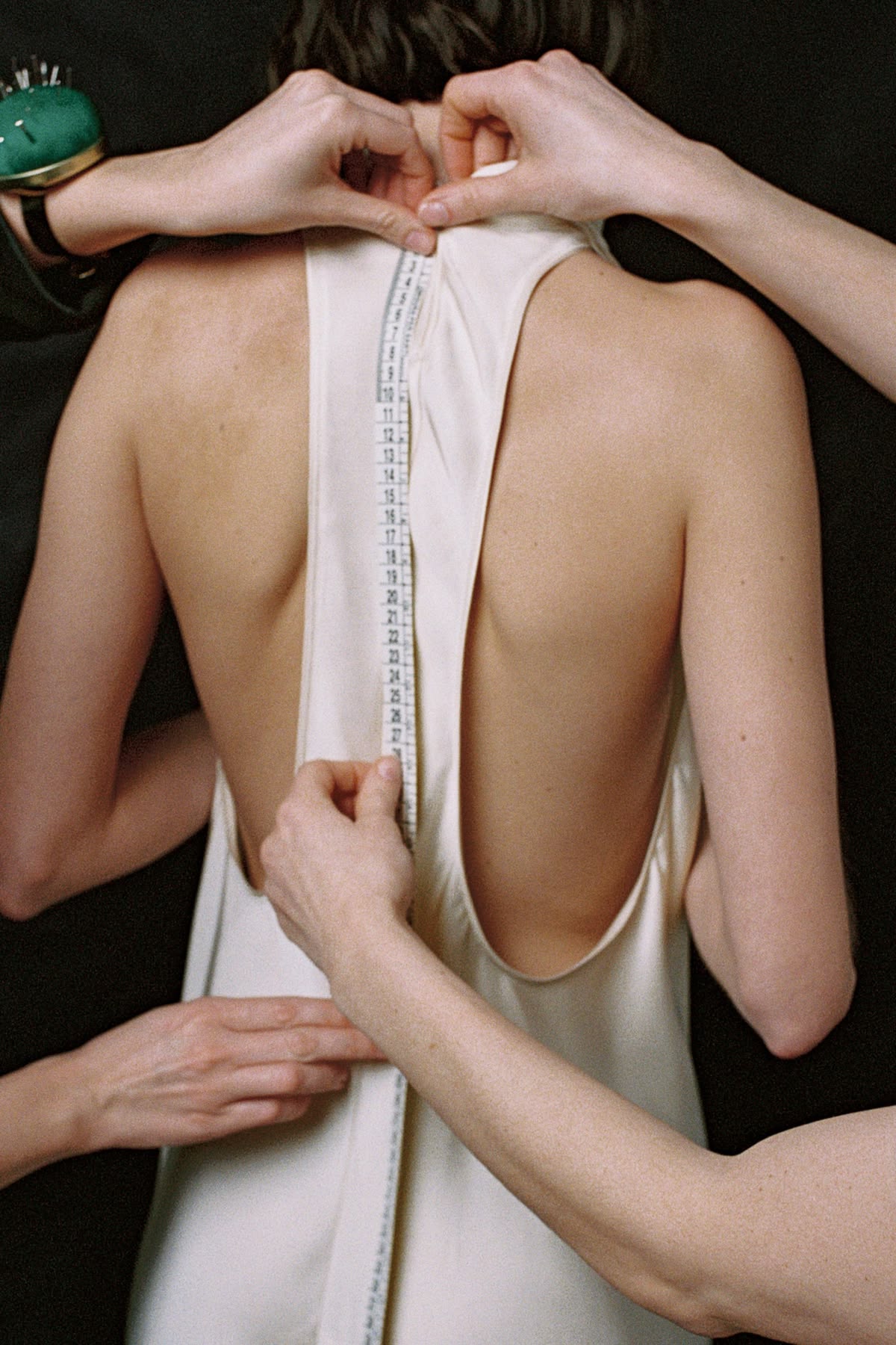 Wedding dress pinned for alterations at Sol Quality Cleaners Weston